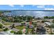 Aerial view of waterfront home with large lot and nearby construction at 1160 Morningside Pl, Sarasota, FL 34236