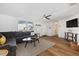 Spacious living room with sectional sofa and hardwood floors at 1160 Morningside Pl, Sarasota, FL 34236