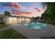Evening view of the pool and patio area at 1160 Morningside Pl, Sarasota, FL 34236