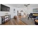 Open living area with hardwood floors and a sectional sofa at 1160 Morningside Pl, Sarasota, FL 34236