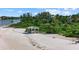 Beachfront gazebo near lush vegetation and waterfront homes at 1160 Morningside Pl, Sarasota, FL 34236