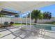 Screened patio with pool access and outdoor furniture at 1160 Morningside Pl, Sarasota, FL 34236