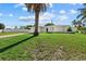 White single story house with a palm tree in front and a fence at 1160 Morningside Pl, Sarasota, FL 34236