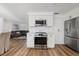 Modern kitchen with stainless steel appliances and white cabinetry at 1160 Morningside Pl, Sarasota, FL 34236