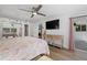 Bright bedroom with king-size bed and sliding glass doors at 1160 Morningside Pl, Sarasota, FL 34236