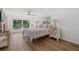 Main bedroom with king-size bed and access to the pool at 1160 Morningside Pl, Sarasota, FL 34236