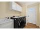 Laundry room with washer, dryer, and utility sink at 1160 Morningside Pl, Sarasota, FL 34236