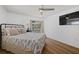 Bedroom with a queen bed, wood-look floors, and backyard access at 1160 Morningside Pl, Sarasota, FL 34236