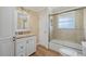 Bathroom with a tub, shower, and updated vanity at 1160 Morningside Pl, Sarasota, FL 34236