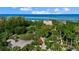 Aerial view of a beachfront property with a gated entrance at 1160 Morningside Pl, Sarasota, FL 34236