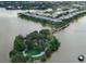 Scenic aerial view of the community, lake, and pier at 6414 Moorings Point Cir # 201, Lakewood Ranch, FL 34202