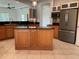 Modern kitchen with a center island, stainless steel appliances and granite counters at 6414 Moorings Point Cir # 201, Lakewood Ranch, FL 34202