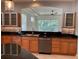 Spacious kitchen featuring granite countertops, stainless steel appliances, and tile backsplash at 6414 Moorings Point Cir # 201, Lakewood Ranch, FL 34202