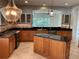 Well-appointed kitchen features granite countertops and a center island at 6414 Moorings Point Cir # 201, Lakewood Ranch, FL 34202