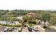 Community view with pool, lush landscaping, and parking at 7612 Lake Vista Ct # 405, Lakewood Ranch, FL 34202