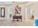 Entryway with decorative console table and large artwork at 7612 Lake Vista Ct # 405, Lakewood Ranch, FL 34202