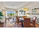 Dining area with a round table and leather chairs at 7612 Lake Vista Ct # 405, Lakewood Ranch, FL 34202