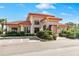Community clubhouse with attractive landscaping at 7612 Lake Vista Ct # 405, Lakewood Ranch, FL 34202