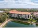 Lakefront condo building with balconies and scenic views at 7612 Lake Vista Ct # 405, Lakewood Ranch, FL 34202