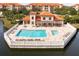 Resort-style pool and clubhouse with a relaxing patio area at 7612 Lake Vista Ct # 405, Lakewood Ranch, FL 34202
