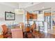 Open kitchen and dining area with wood cabinets and granite countertops at 7612 Lake Vista Ct # 405, Lakewood Ranch, FL 34202