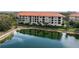 Luxury condo building overlooking a tranquil lake at 7612 Lake Vista Ct # 405, Lakewood Ranch, FL 34202