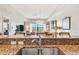 Kitchen with granite countertops, stainless steel appliances, and open living area view at 7612 Lake Vista Ct # 405, Lakewood Ranch, FL 34202