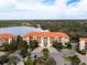 Elegant condo building with lake views and ample parking at 7612 Lake Vista Ct # 405, Lakewood Ranch, FL 34202