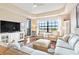 Bright living room with a large window and comfortable furniture at 7612 Lake Vista Ct # 405, Lakewood Ranch, FL 34202