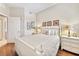 Guest bedroom with white wooden bed frame and hardwood floors at 7612 Lake Vista Ct # 405, Lakewood Ranch, FL 34202