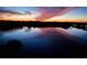 Breathtaking sunset reflected on a calm lake at 7612 Lake Vista Ct # 405, Lakewood Ranch, FL 34202