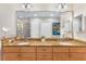 Bathroom with dual vanities and granite countertop at 7612 Lake Vista Ct # 405, Lakewood Ranch, FL 34202