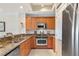 Well-equipped kitchen featuring granite countertops and stainless steel appliances at 7612 Lake Vista Ct # 405, Lakewood Ranch, FL 34202