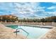 Inviting resort-style pool with ample lounge chairs at 7612 Lake Vista Ct # 405, Lakewood Ranch, FL 34202
