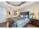 Bright bedroom with a king-size bed and hardwood flooring at 7612 Lake Vista Ct # 405, Lakewood Ranch, FL 34202