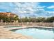 Inviting resort-style pool with ample lounge chairs at 7612 Lake Vista Ct # 405, Lakewood Ranch, FL 34202