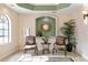 Lobby with seating area, decorative mirror, and potted plant at 7612 Lake Vista Ct # 405, Lakewood Ranch, FL 34202