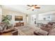 Bright and airy living room with leather seating and a large TV at 203 65Th E Ave, Bradenton, FL 34203