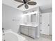 Bathroom with double vanity, gray cabinets, and marble-style flooring at 14312 Barbarossa Ln, Port Charlotte, FL 33981