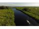 Sailboat on a waterway with lush foliage at 14312 Barbarossa Ln, Port Charlotte, FL 33981