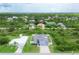 Aerial view of a house with a pool and fenced backyard in a residential area at 14312 Barbarossa Ln, Port Charlotte, FL 33981