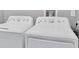 Laundry room with a white washer and dryer set at 14312 Barbarossa Ln, Port Charlotte, FL 33981