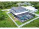 Aerial view of the property showing a two-story home with a large fenced backyard and pool at 14312 Barbarossa Ln, Port Charlotte, FL 33981