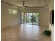 Living area with sliding doors to balcony and tile floors at 6414 Moorings Point Cir # 201, Lakewood Ranch, FL 34202