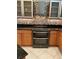 Modern kitchen with stainless steel appliances and tile backsplash at 6414 Moorings Point Cir # 201, Lakewood Ranch, FL 34202