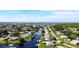 Aerial view of waterfront community with lush landscaping and canals at 193 Carlisle Nw Ave, Port Charlotte, FL 33952