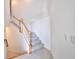 Modern staircase with carpeted steps and white railing at 5707 N Honore Ave # 621, Sarasota, FL 34243