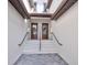 Modern townhome entry with double doors and mermaid statue at 5707 N Honore Ave # 621, Sarasota, FL 34243