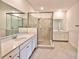 Elegant bathroom with a large shower and double vanity at 5707 N Honore Ave # 621, Sarasota, FL 34243
