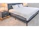 King-size bed in a well lit bedroom at 5707 N Honore Ave # 621, Sarasota, FL 34243